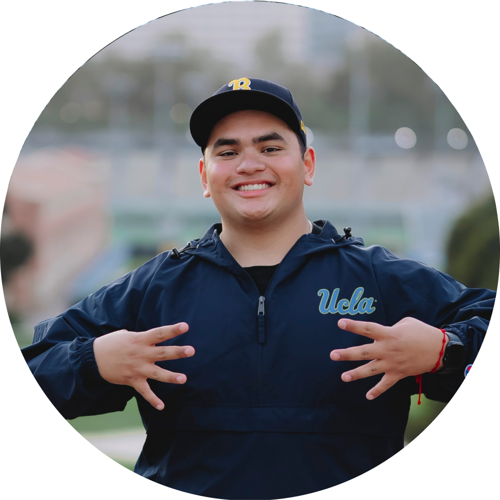 Student holding up four fingers hand sign