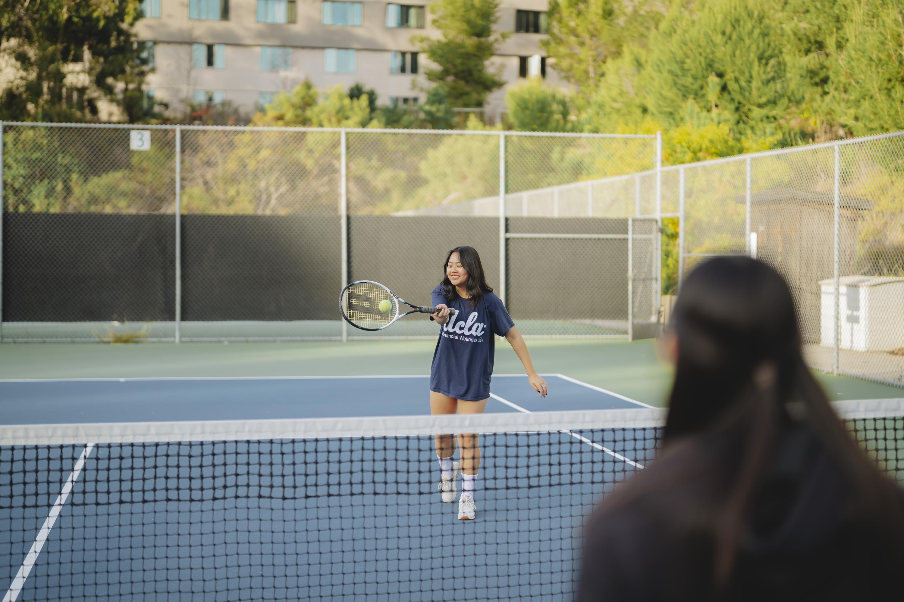 students playing tennis